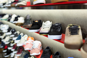 Wall Mural - Shelves with casual fashionable stylish shoes and sneakers at shopping mall