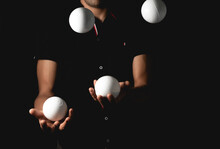 Close Up Portrait Of Juggling Balls, On Black Background