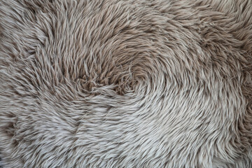Closeup detail of gray swirled fake fur rug