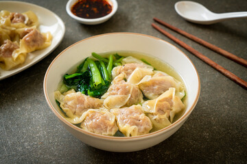 Wall Mural - pork wonton soup or pork dumplings soup with vegetable