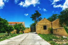 Old Derelict House With Trees And Garden On Island Bonaire