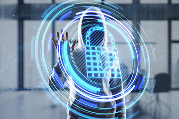 Canvas Print - Hacker hand using glowing padlock hologram on blurry office interior background. Secure, data theft, malware, safety and web protection concept. Double exposure.