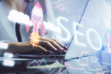 Poster - Double exposure of woman hands working on computer and seo hologram drawing. internet search concept.