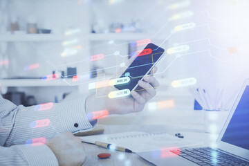 Poster - Double exposure of man's hand holding and using a digital device and data theme hologram drawing. Technology concept.
