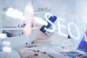 Poster - Multi exposure of man's hands holding and using a digital device and seo drawing. search optimization concept.
