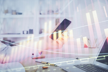 Aufkleber - Double exposure of man's hands holding and using a digital device and forex graph drawing. Financial market concept.