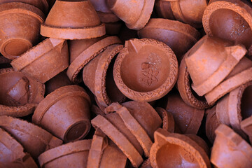 diya or clay lamp at market during Diwali festival in India.