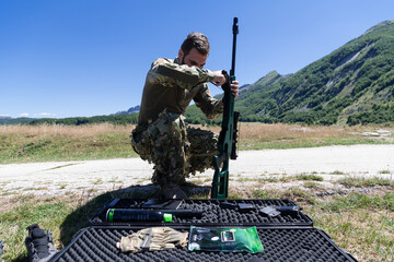 special operations soldiers team preparing tactical and communication gear for action battle. Long distance sniper team in checking gear for action