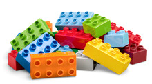 Colorful Children Building Bricks On Background