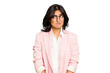 Young Indian business woman wearing a pink suit isolated confused, feels doubtful and unsure.