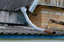Old Drain Pipe On The Roof Of The House