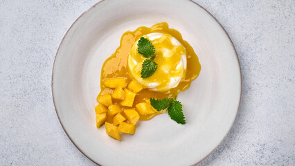 Wall Mural - Panoramic top view panna cotta with natural vanilla pod, mango syrup and mint, high key