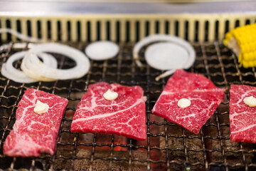 Wall Mural - Close up of beef on barbecue grill. Close up