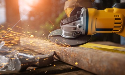 Poster - Male worker using tools works in the workshop.