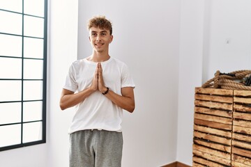 Sticker - Young caucasian man smiling confident training yoga at sport center