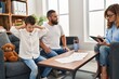 © Krakenimages.com - Family having psychology session son with hands on ears at psychology center