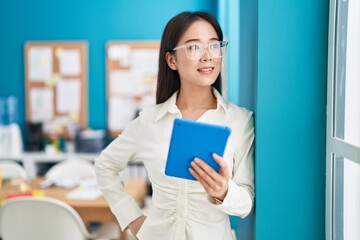 Sticker - Young chinese woman business worker smiling confident using touchpad at office