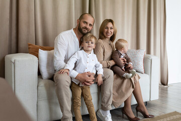 portrait of a stylish young family with two male children