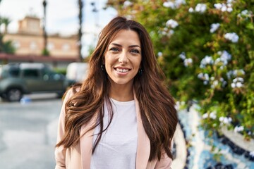 Poster - Young hispanic woman smiling confident walking at park