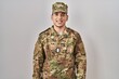 © Krakenimages.com - Young arab man wearing camouflage army uniform with a happy and cool smile on face. lucky person.