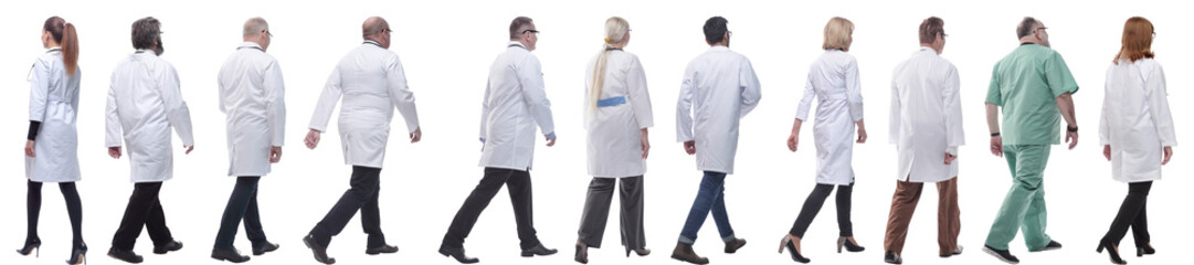 group of doctors in motion isolated on white