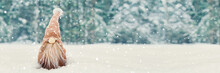 Christmas Banner With Cute Gnome In Snowy Winter Forest, Copy Space. Fairytale Snowfall