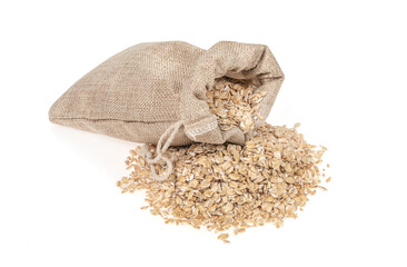 Wall Mural - Oat flakes in jute burlap bag isolated on white background, close up. oatmeal. barley flakes. rolled oat