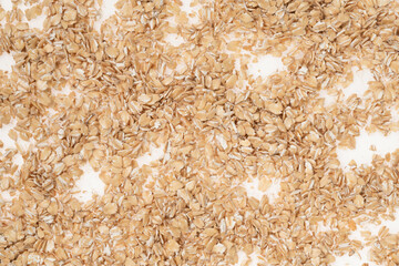 Wall Mural - Oat flakes on white background, close up. oatmeal. barley flakes. rolled oat