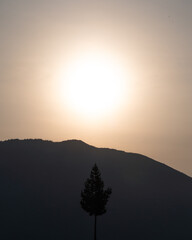 Wall Mural - Photograph of a sunrise over the mountains, first ray of sun
