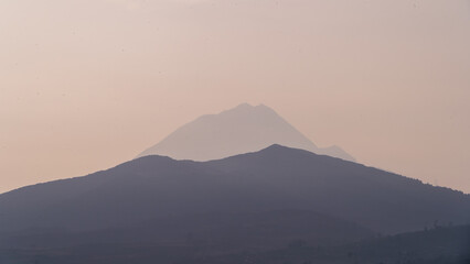 Wall Mural - Photograph of a sunrise over the mountains, first ray of sun