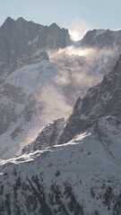 Poster - Vertical breathtaking view of the snowy mountain in the highlands