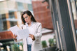 Fashion business woman with financial papers