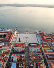 Aerial View Of Lisbon Main Square (Praca Do Comercio) Along The Tagus River At Sunset, Lisbon, Portugal.
