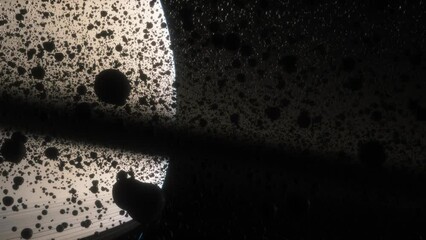 Wall Mural - Cinematic animation of Saturn's rings made of rocks, dust and ice. Planet Saturn is a huge planet of the solar system with beautiful rings. Asteroid field near the planet
