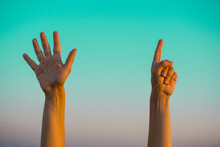 Woman Hands Showing Or Doing Number Seven Gesture On Turquoise Summer Sky Background. Counting Down, Six Fingers Up Concept Idea. 