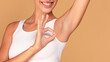 Happy lady showing her smooth armpit and ok gesture, enjoying underarm depilation result, panorama with copy space
