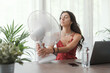 © StockPhotoPro - Woman cooling herself at home