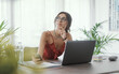 © StockPhotoPro - Woman sitting at desk and thinking
