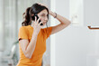 © StockPhotoPro - Woman calling a boiler breakdown service