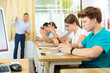 © JackF - Portrait of teen pupils using mobile phones during lesson