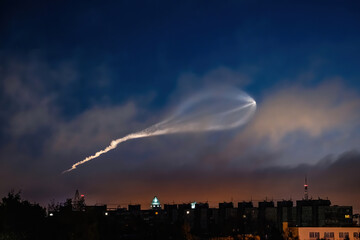 Soyuz space rocket launch. Space jellyfish in sky. Plume of rocket gases in sun at dawn.