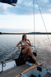 © 3kstudiok - Feminine woman enjoying summer day on yacht with closed eyes