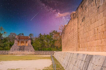 Stone wall with a ring of Grand Ball Court, Gran Juego de Pelota of Chichen Itza archaeological site in Yucatan, Mexico with Milky Way Galaxy stars night sky