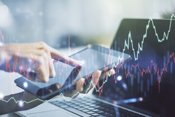 Poster - Abstract creative financial graph with finger clicks on a digital tablet on background, financial and trading concept. Multiexposure