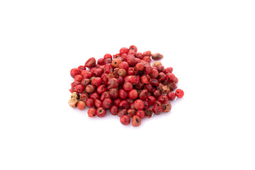 Wall Mural - Pink peppercorns seeds isolated on white background.