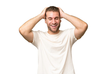 Wall Mural - Young handsome caucasian man isolated on green chroma background laughing