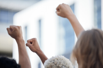 Fist, activism and crowd solidarity protest against racism and oppression, fight for diversity and equality. Unity, determined activist rally together for human rights violation and freedom of speech