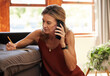 © N Lawrenson/peopleimages.com - Senior woman, phone call and writing in home on book, planning or talking and taking notes. Business, elderly woman and 5g mobile finance conversation, speaking or discussion with notebook in house.