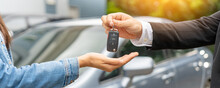 Lease, Rental Car, Sell, Buy. Dealership Manager Send Car Keys To The New Owner.  Sales, Loan Credit Financial, Rent Vehicle, Insurance,  Renting, Seller, Dealer, Installment, Car Care Business