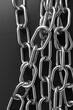 Metal rings connected together in several chrome chain closeup view. 3d illustraion of chain